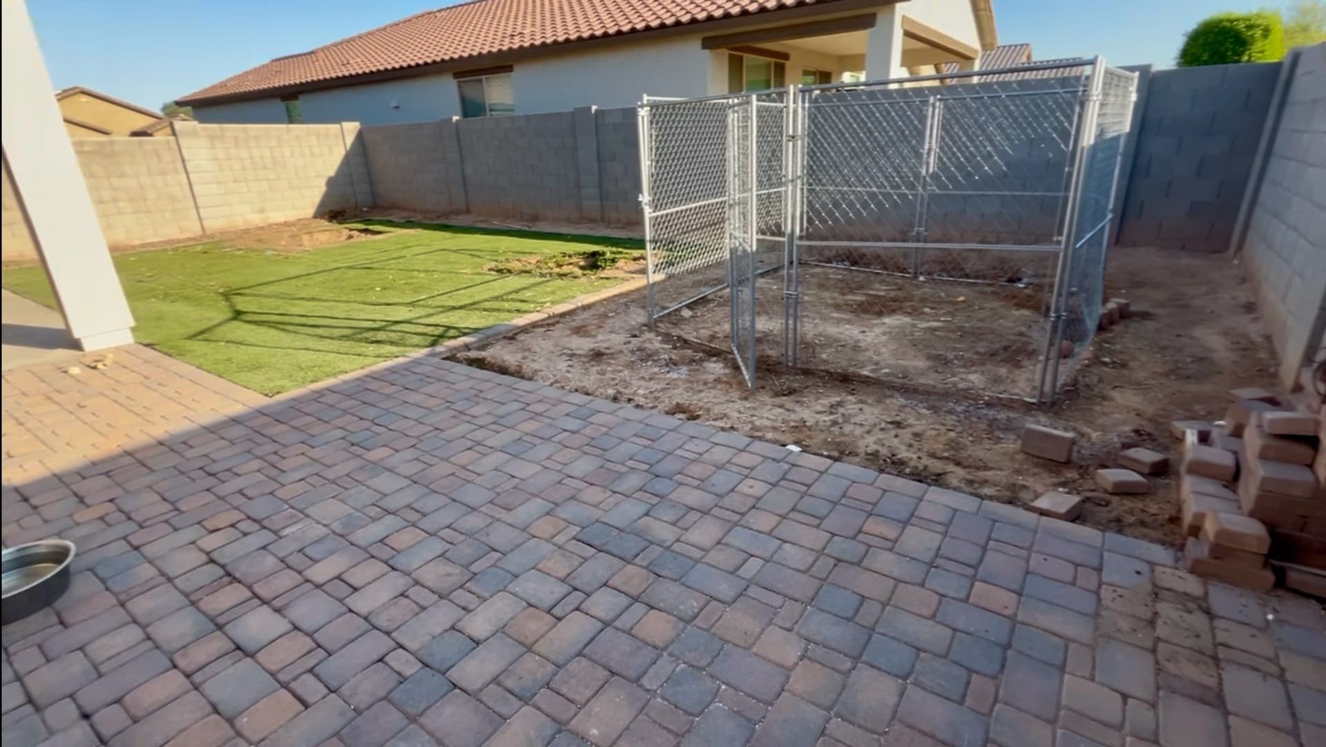 Backyard Makeover with Elegant Patio and Turf image